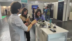 Matthias Lindner from vGreens explains to Susanna Lössl and Leonie Prusinovsky (both AVF team members) how the Vertical Farm from vGreens works.